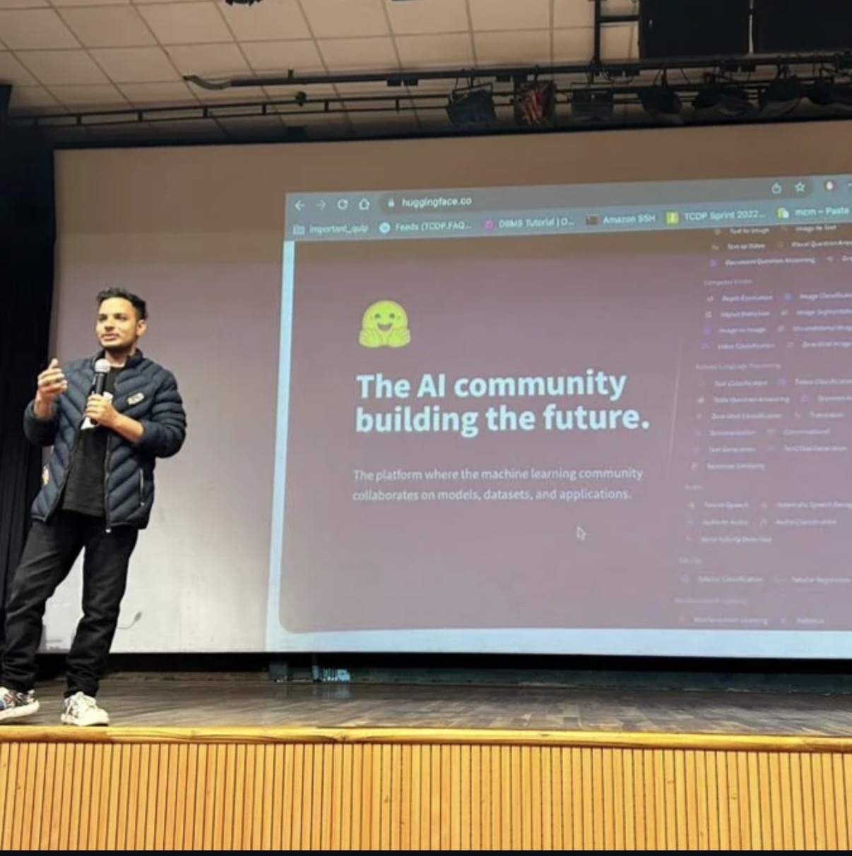 Bittoo speaking on stage about Hugging Face and the AI community